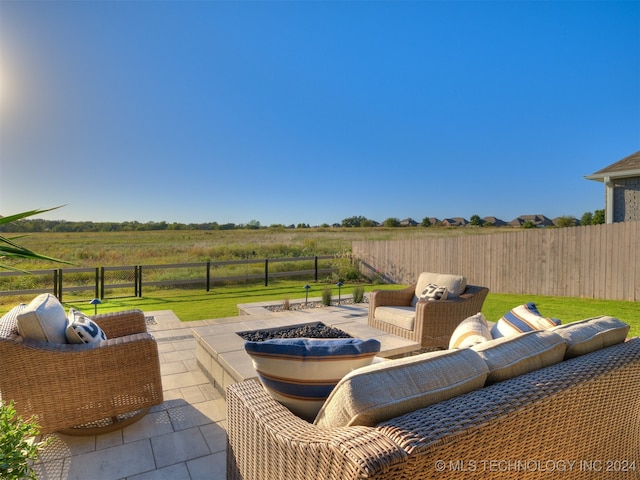 view of patio / terrace with an outdoor hangout area and a rural view