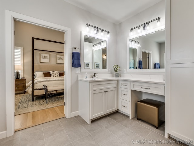 bathroom featuring tile patterned flooring and vanity