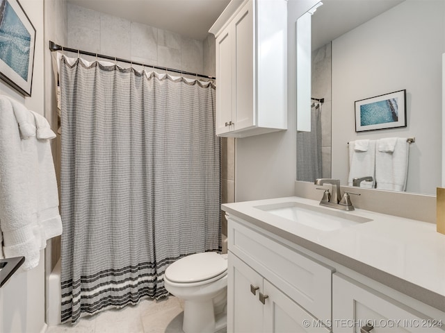 full bathroom featuring vanity, shower / bath combo with shower curtain, toilet, and tile patterned floors