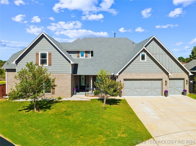 craftsman inspired home featuring a porch and a front yard