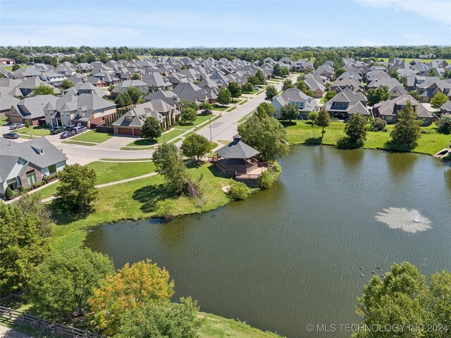 birds eye view of property with a residential view and a water view