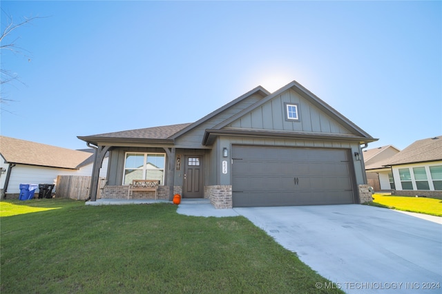 craftsman-style home with a garage and a front yard