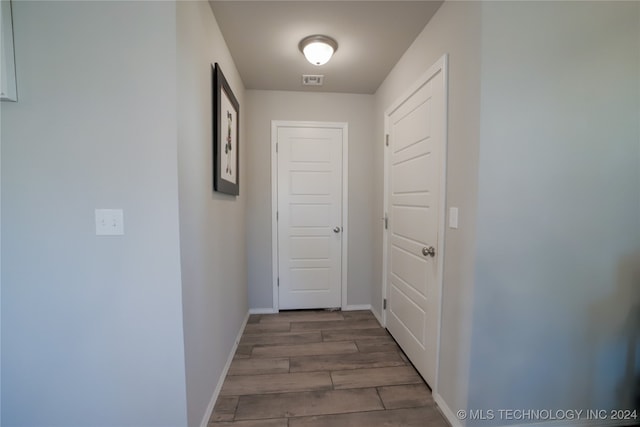 hallway featuring hardwood / wood-style floors