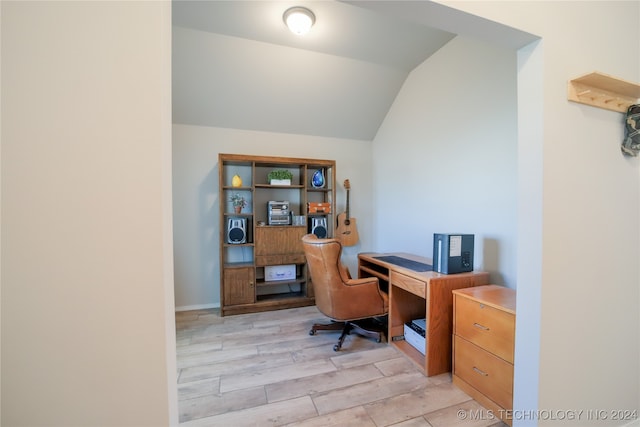 office area featuring light hardwood / wood-style flooring and lofted ceiling