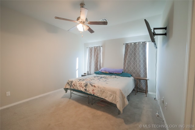 bedroom with ceiling fan and carpet floors