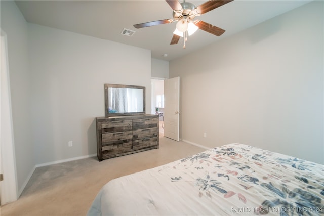 bedroom featuring ceiling fan and light carpet