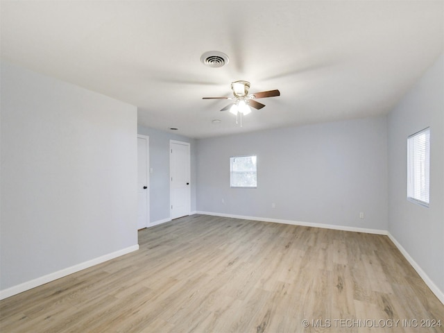 509 G St SW, Ardmore, OK 73401 - empty room featuring ceiling fan, visible vents, baseboards, and light wood-type flooring