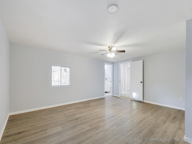 509 G St SW, Ardmore, OK 73401 - unfurnished room with baseboards, ceiling fan, and wood finished floors