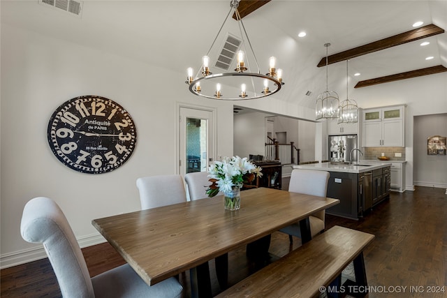 dining room featuring sink, dark wood-type flooring, and vaulted ceiling with beams