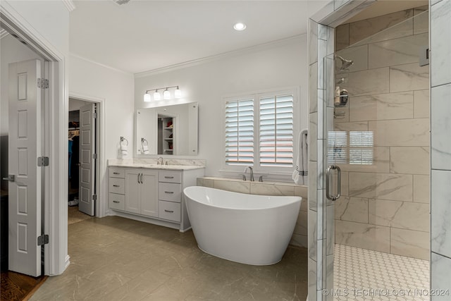 bathroom with vanity, ornamental molding, and plus walk in shower