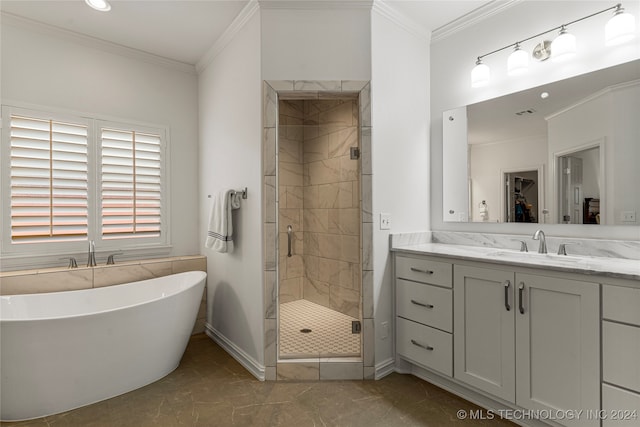 bathroom with vanity, crown molding, independent shower and bath, and tile patterned floors