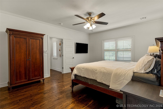 bedroom featuring ornamental molding, dark hardwood / wood-style floors, and ceiling fan