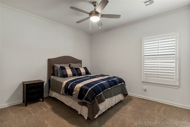 carpeted bedroom featuring ceiling fan and ornamental molding