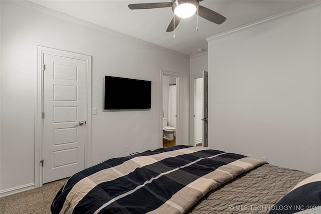 carpeted bedroom with connected bathroom, ceiling fan, and crown molding