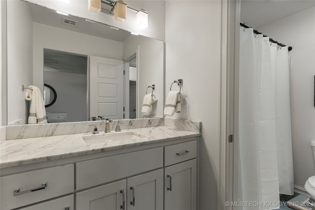 bathroom with vanity and toilet