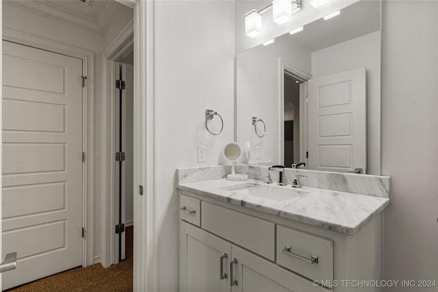 bathroom with vanity and ornamental molding