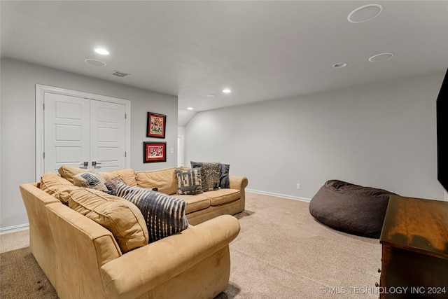 cinema room featuring light carpet