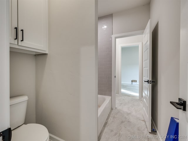 bathroom featuring shower with separate bathtub and toilet