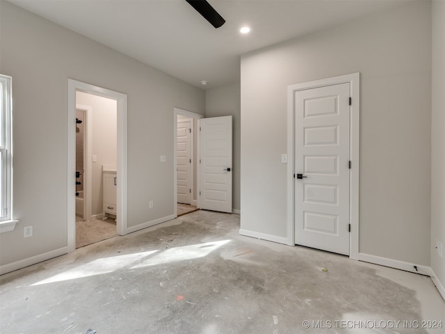 unfurnished bedroom with ceiling fan and ensuite bathroom