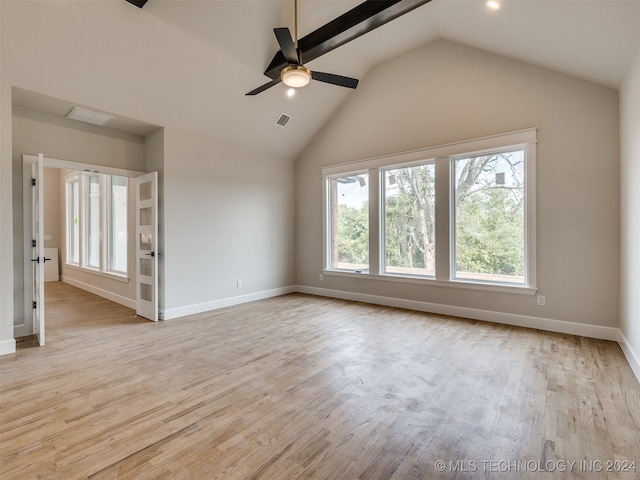 interior space featuring ceiling fan, lofted ceiling, and light hardwood / wood-style floors