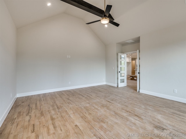 unfurnished room with lofted ceiling, light hardwood / wood-style floors, and ceiling fan