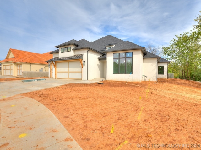 prairie-style house featuring a garage