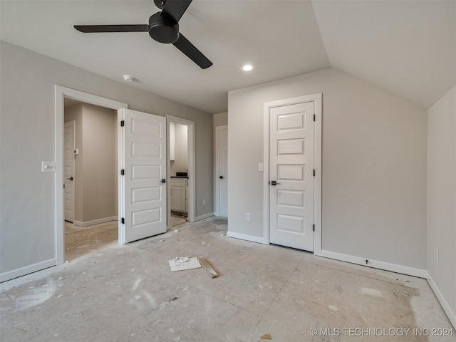 unfurnished bedroom with vaulted ceiling, ceiling fan, and ensuite bath