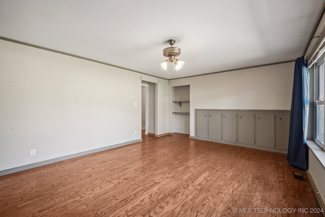 interior space with light hardwood / wood-style floors, a mail area, and a wealth of natural light