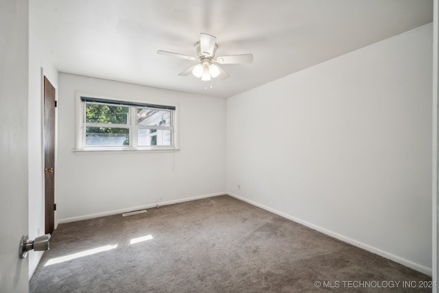 empty room with carpet floors and ceiling fan