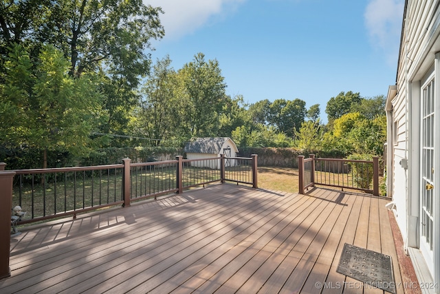 deck featuring a shed