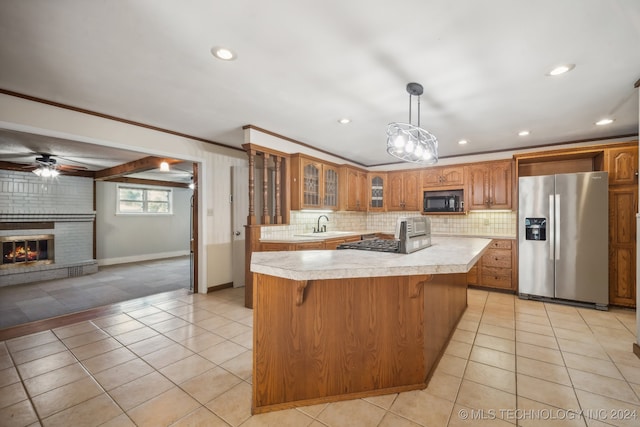 kitchen featuring stainless steel fridge, ornamental molding, a center island, and light tile patterned floors