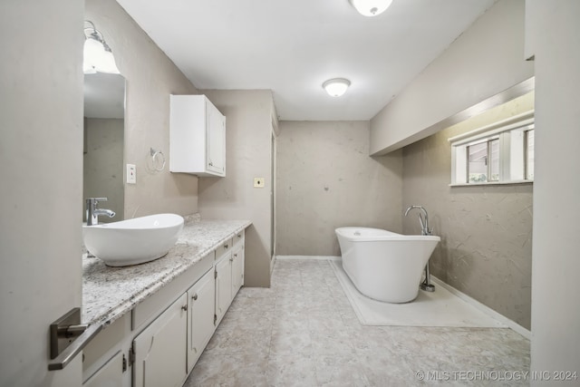 bathroom with a bathtub and vanity