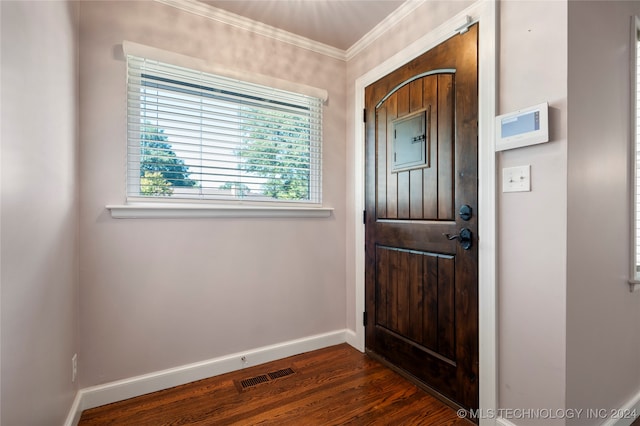 entrance foyer with crown molding and dark hardwood / wood-style flooring