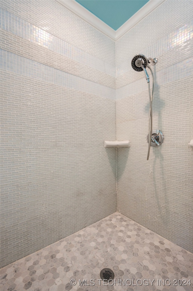 bathroom with a tile shower