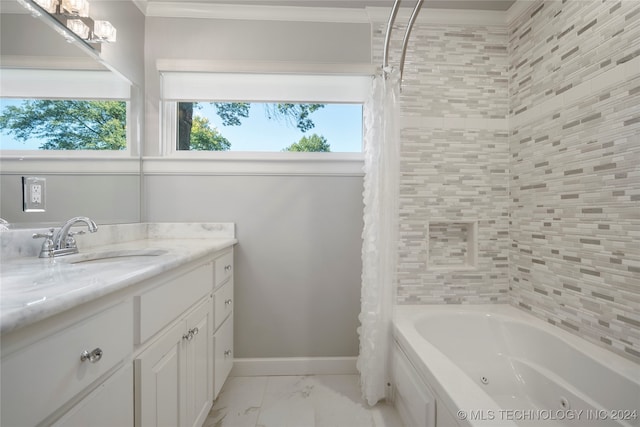 bathroom with vanity, crown molding, and shower / tub combo with curtain