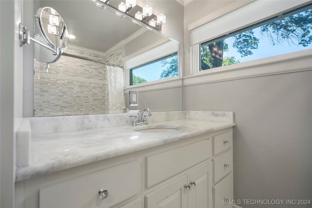 bathroom featuring a shower with shower curtain and vanity