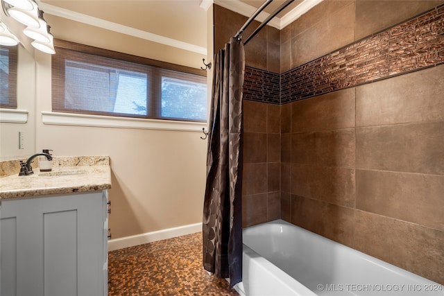 bathroom with vanity, ornamental molding, and shower / tub combo with curtain