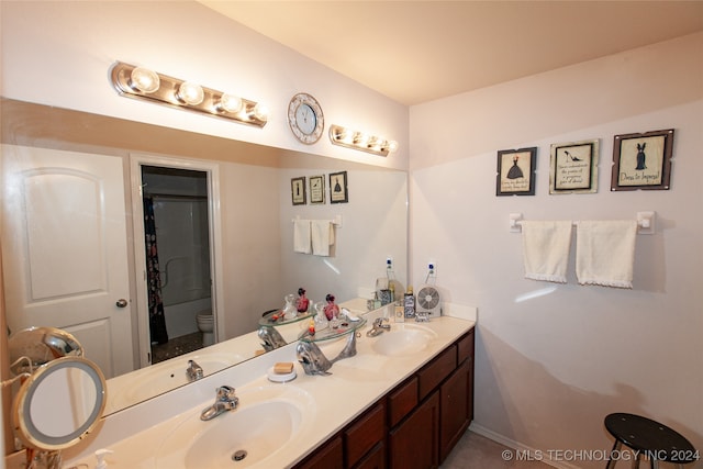 bathroom with vanity, toilet, and a shower with shower curtain