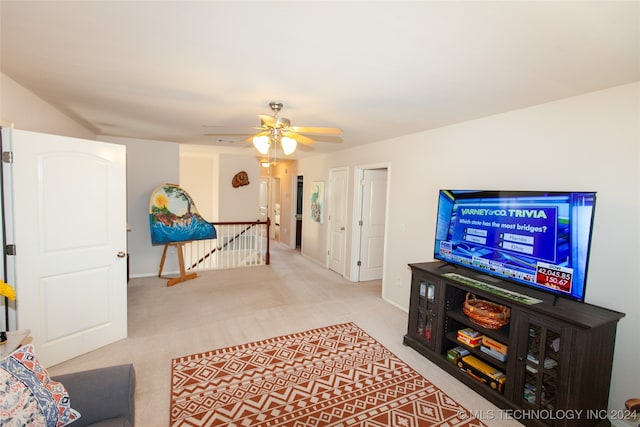 living room with light carpet and ceiling fan