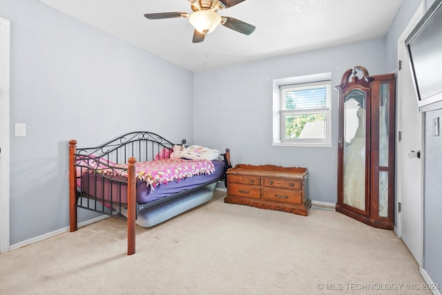 carpeted bedroom with ceiling fan