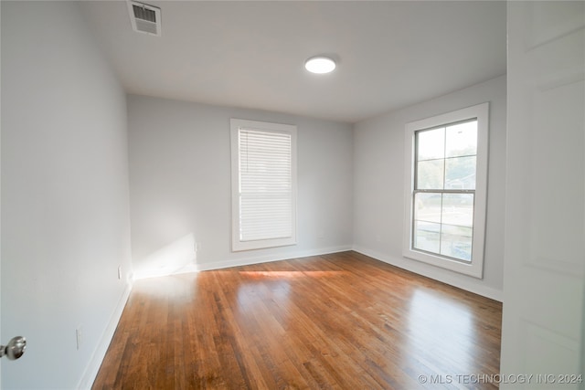 empty room featuring hardwood / wood-style floors