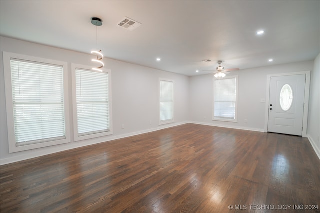 foyer with ceiling fan and dark wood-type flooring