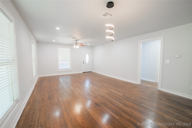 spare room featuring dark hardwood / wood-style floors and ceiling fan