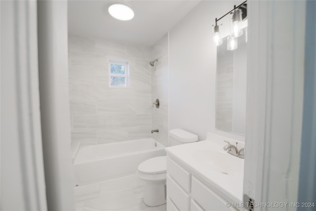 full bathroom featuring vanity, toilet, and tiled shower / bath combo