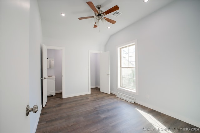 unfurnished bedroom featuring lofted ceiling, ceiling fan, and dark wood-type flooring