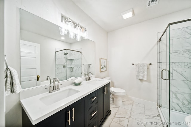 bathroom with vanity, toilet, and an enclosed shower