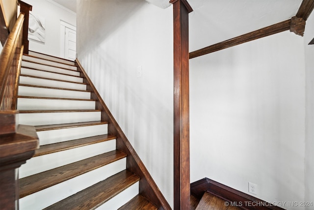 stairway featuring hardwood / wood-style flooring