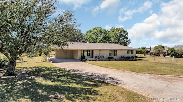 ranch-style house with a front lawn and a carport