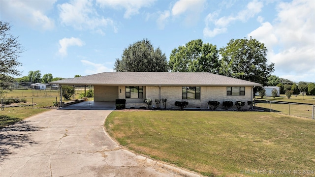 view of front of property with a carport and a front yard