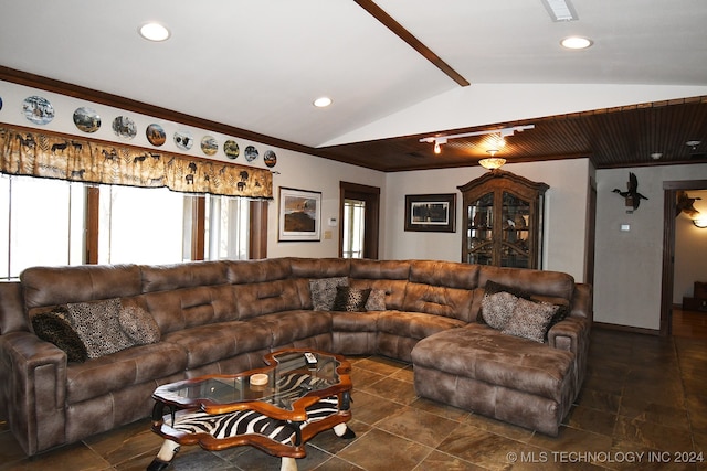 living room featuring lofted ceiling and crown molding